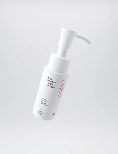 The Glow Factor Luxury Base Oil Body Edition Travel Size – Emulsión Corporal Hidratante con Jojoba y Ácido Hialurónico x 60ml