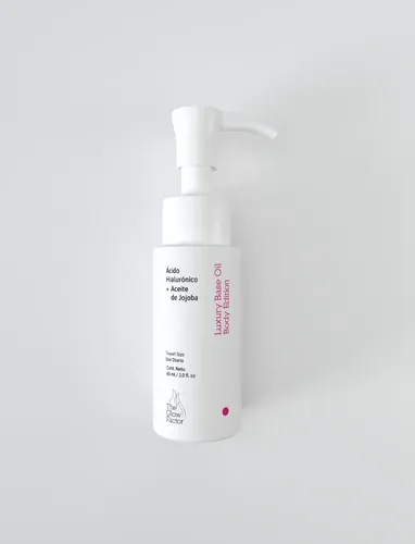 The Glow Factor Luxury Base Oil Body Edition Travel Size – Emulsión Corporal Hidratante con Jojoba y Ácido Hialurónico x 60ml